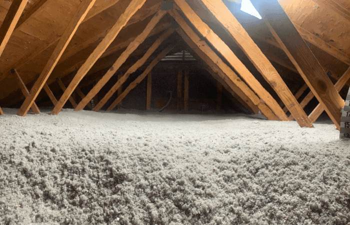 Colair technician installing attic insulation in an Ottawa home