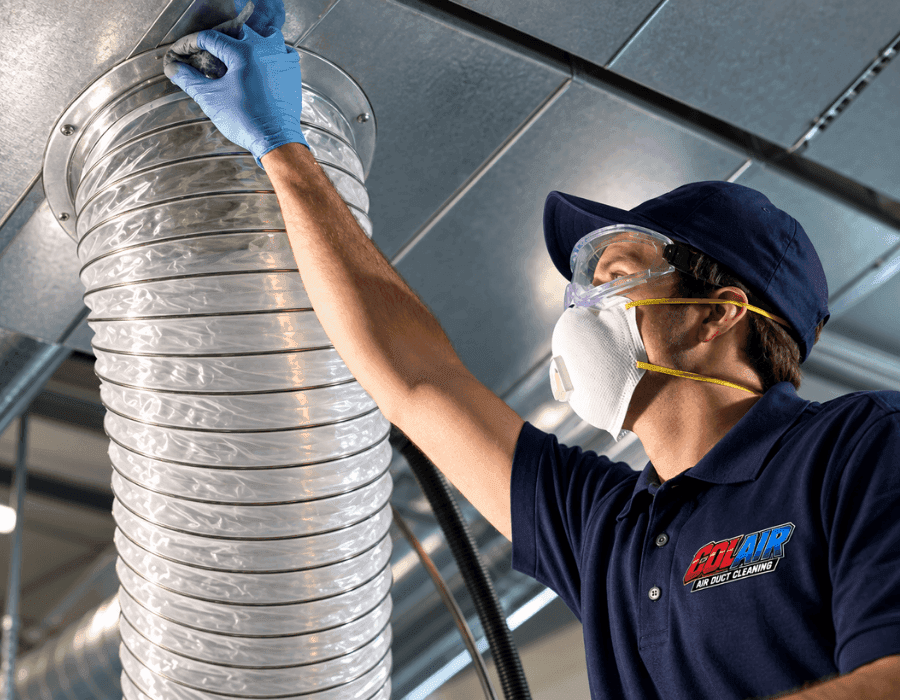 Colair technician cleaning a vent in an Ottawa home