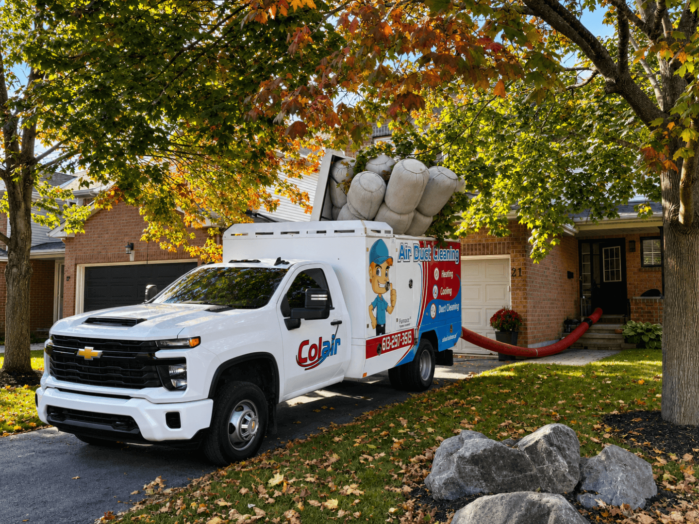 Colair truck-mounted air duct cleaning equipment at a home in Ottawa