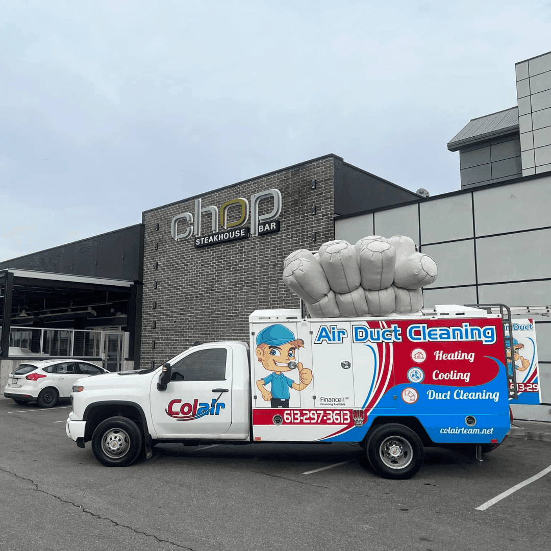 Colair truck parked at a restaurant during a commercial job in Ottawa