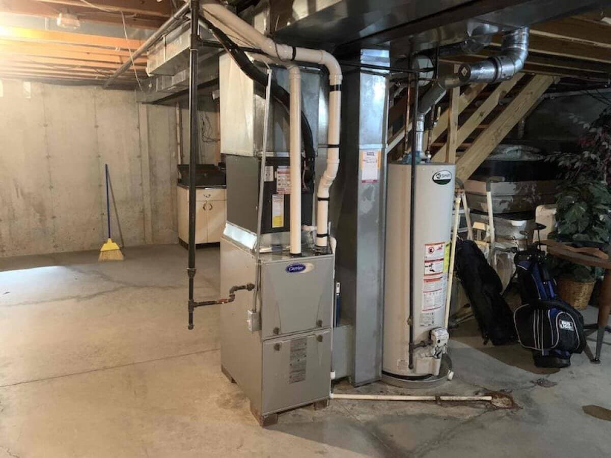 Furnace with an air conditioning coil installed in a basement