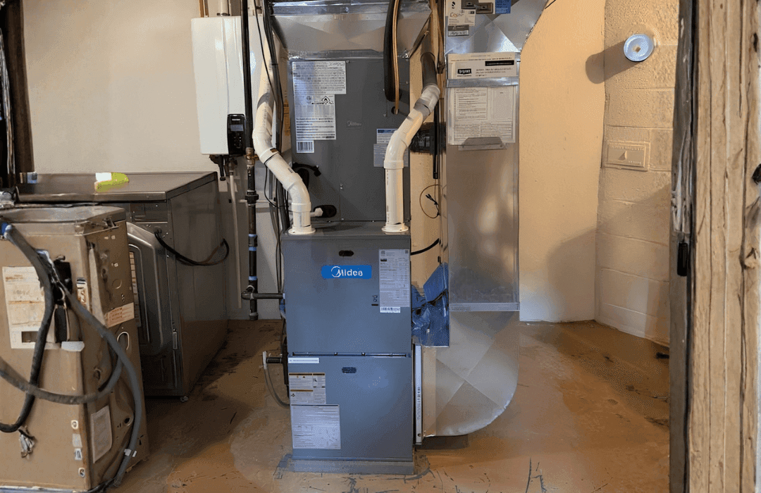 Technician replacing a furnace in an Ottawa home
