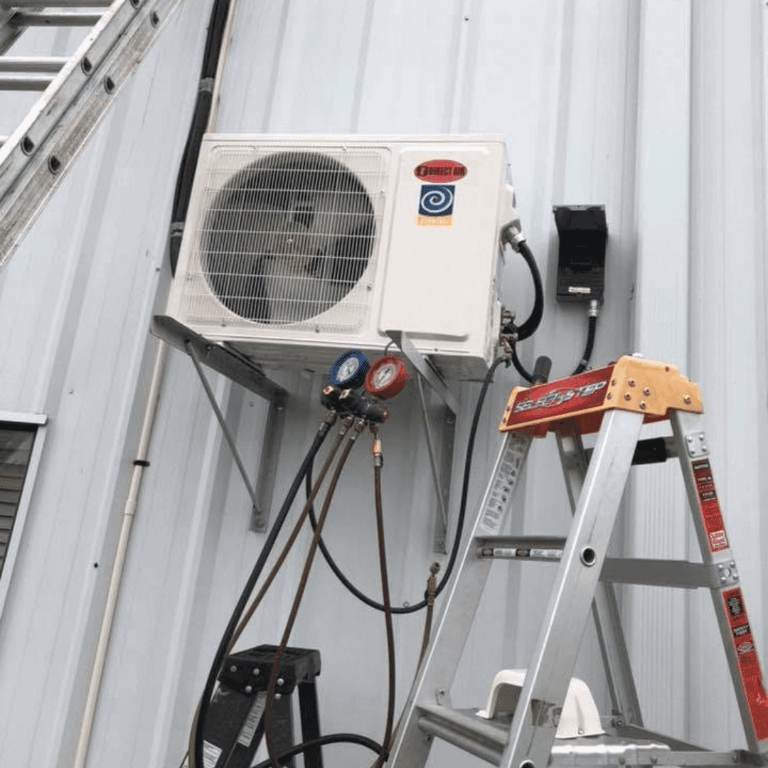 Colair technician pressure testing a newly installed air conditioner in Ottawa